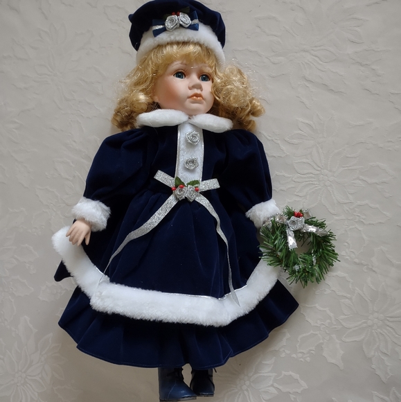 Fine Porcelain blonde doll special edition royal blue velvet faux fur dress